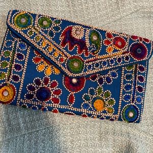 Hand embroidered clutch